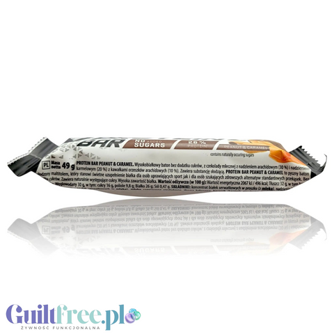 Baton proteinowy Guiltfree Trec Peanut & Caramel w opakowaniu z informacją o 26% białka i braku dodatku cukru.